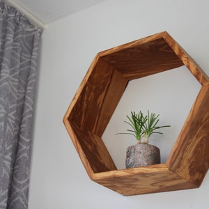 Hexagon wall shelf made of olive wood image 2