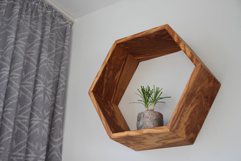 Hexagon wall shelf made of olive wood image 2