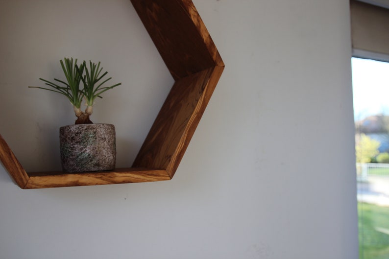 Hexagon wall shelf made of olive wood image 6