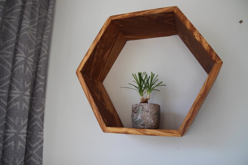 Hexagon wall shelf made of olive wood image 4