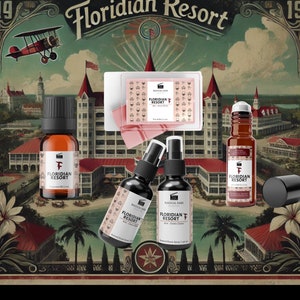 May include: A set of bath and body products with a vintage travel theme. The products include a bar of soap, a roll-on bottle, a bottle of essential oil, and two bottles of room spray. The products are all labelled with the text "Floridian Resort" and a vintage-style logo. The background is a vintage postcard image of a resort.