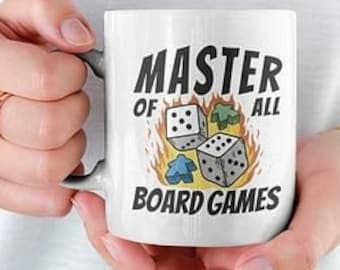 May include: White ceramic mug with a black and white illustration of dice on fire. The text "Master of all Board Games" is printed on the mug.