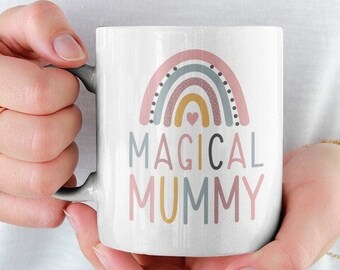 May include: White ceramic mug with a rainbow design and the text "MAGICAL MUMMY".