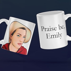May include: Two white ceramic mugs. One mug features a cartoon illustration of a woman wearing a red dress and a white bonnet. The other mug has the text "Praise be, Emily" printed on it.