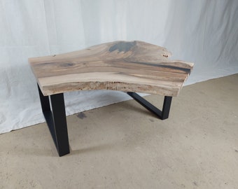 Artfully handmade coffee table made of walnut wood / epoxy resin black