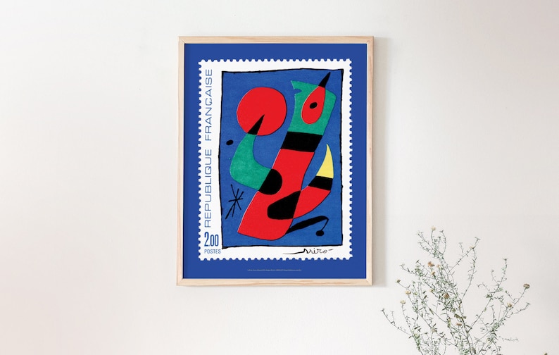 May include: A framed poster of a colorful abstract painting on a blue background. The painting features a red, green, and black abstract figure with a yellow detail. The poster has a stamp design with the text "REPUBLIQUE FRANCAISE" and "200 POSTES".