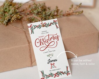 Puede incluir: Una etiqueta de regalo de Navidad blanca con un diseño de corona roja y verde. La etiqueta dice "Wishing you a very Merry Christmas & A Happy New Year to James with love The Jones Family".