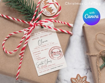 Puede incluir: Etiqueta de regalo de Navidad editable con un lazo de cuerda rojo y blanco, un sello rojo y blanco "Feliz Navidad" y el texto "North Pole Gift Workshop Property of St. Nicholas Elf Special Delivery for Olivia (Open by December 25; 12 AM) Notes (Elf Use Only): Naughty Nice Needs Improvement Santa Claus St. Nicholas 123 Elf Road North Pole With Love From Spencer Family"