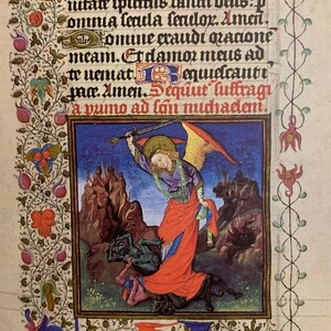 A medieval manuscript page with a hand-painted illustration of an angel with a sword defeating a demon. The angel is depicted with wings, a halo, and a long red robe. The demon is green and has horns. The text on the page reads: 'et nynas aim deo patir in u utate spurtus fancti dais:p omnia lauda fenilor. Amen. Хотше стаиdi radone meam. Erdamos mais ad to uemat equideantr paa. Amen.equut luftragi a vumo ad lon muchadan.'