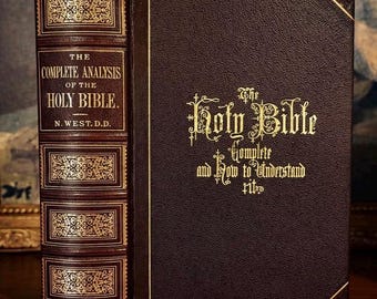 May include: A dark brown leather-bound book titled The Complete Analysis of the Holy Bible by N. West, D.D. The front cover features gold embossed text reading The Holy Bible Complete and How to Understand It, with decorative gold spine panels.