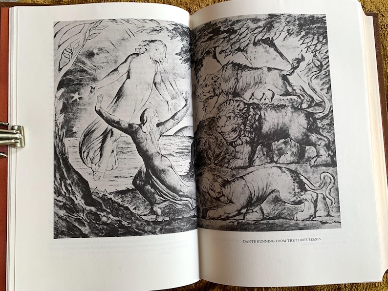 May include: A black and white illustration of a scene from Dante's Inferno. A man runs away from three beasts: a lion, a leopard, and a she-wolf. The text "Dante Running from the Three Beasts" is at the bottom of the image.