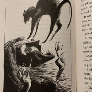 May include: A black and white book illustration depicting a dark, arched-back cat hovering above a figure with long hair and a button over one eye. The figure has elongated, claw-like fingers reaching upward toward the cat in a dramatic scene.