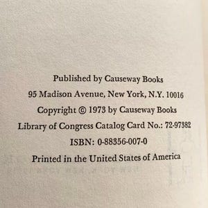 May include: Close-up of a book page with text. The text includes the publisher's name, address, copyright information, Library of Congress catalog card number, ISBN, and the phrase "Printed in the United States of America."