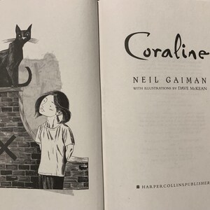 May include: The title page of the book Coraline by Neil Gaiman with illustrations by Dave McKean. The left page features a black and white ink illustration of a cat sitting on a brick wall next to a person, while the right page displays the text.