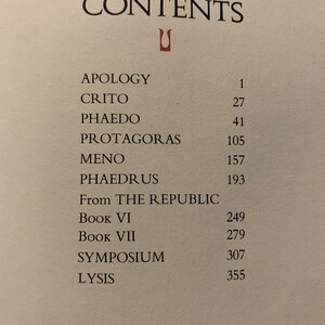 May include: A book's table of contents listing the titles of classic philosophical works, including "Apology", "Crito", "Phaedo", "Protagoras", "Meno", "Phaedrus", and selections from "The Republic".