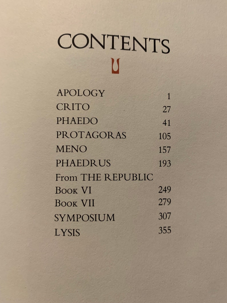 May include: A book's table of contents listing the titles of classic philosophical works, including "Apology", "Crito", "Phaedo", "Protagoras", "Meno", "Phaedrus", and selections from "The Republic".