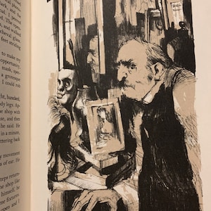 May include: A black and white illustration of a man with a beard and mustache standing in a room with several framed pictures on the wall. He is holding a small framed picture in his hand. The man is looking at the viewer.