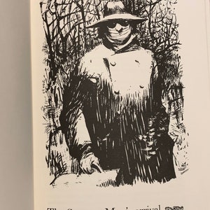 May include: Black and white illustration of a person wearing a hat and a mask, standing in a forest. The text "The Strange Man's arrival" is below the image.