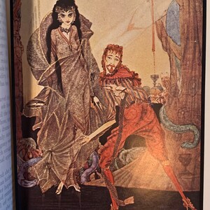 Vintage ornate leather-bound book cover, Edgar Allan Poe collectible illustrated edition with gilt design.