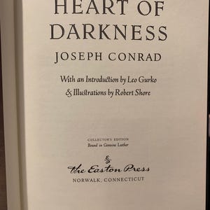 Title page of Heart of Darkness by Joseph Conrad – 1980 Easton Press edition. Elegant typography on cream-colored archival paper. A must-have for fans of classic literature and luxury-bound books.
