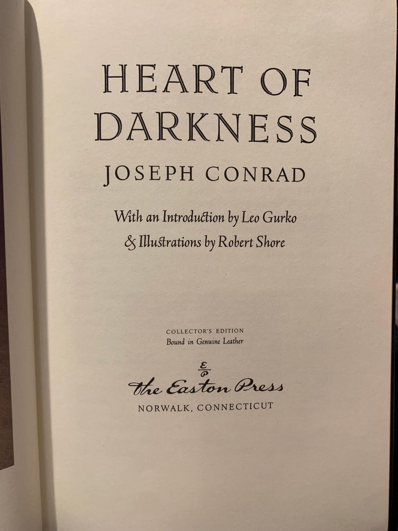Title page of Heart of Darkness by Joseph Conrad – 1980 Easton Press edition. Elegant typography on cream-colored archival paper. A must-have for fans of classic literature and luxury-bound books.