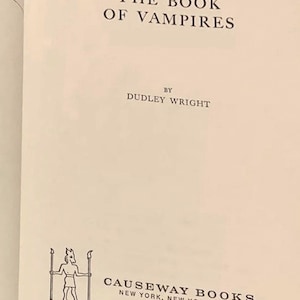 May include: Open book page with the title "THE BOOK OF VAMPIRES" in black text. Below the title is "BY DUDLEY WRIGHT". The bottom of the page features a logo and the text "CAUSEWAY BOOKS NEW YORK, NEW YORK 10016".