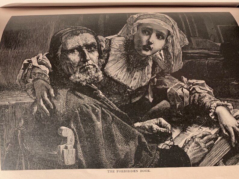 May include: A black and white illustration depicts an older man with a long beard seated, holding a book. A younger person leans over him, their expression concerned. The text "THE FORBIDDEN BOOK" is at the bottom of the image.