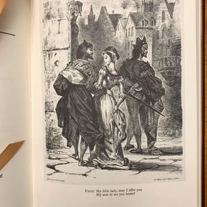 May include: A black and white illustration of three people walking in a city street. The man on the left is wearing a long coat and hat. The woman in the middle is wearing a dress and a hat. The man on the right is wearing a jester's hat and a long coat. The text "FAUST: My little lady, may I offer you My arm to see you home?" is at the bottom of the image.