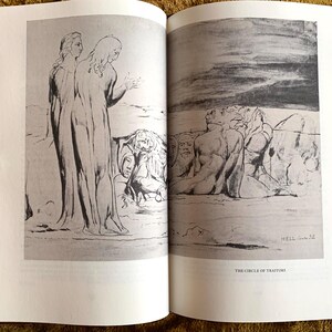 May include: A black and white illustration of a scene from Dante's Inferno. The image depicts two figures standing in the foreground, with a group of figures in the background. The text "The Circle of Traitors" is printed below the image.