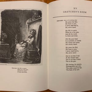 May include: A black and white illustration of a woman sitting in a chair. The woman is looking down and appears to be sad. The text in the image reads "My life is a grave When he is not near, And all the world Is bitter and drear."