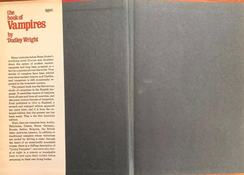 May include: The cover of "The Book of Vampires" by Dudley Wright. The title and author's name are in red text on a white background. The book's spine is dark gray, and the pages contain text about vampires.
