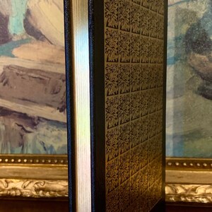 Close-up of the gilded page edges of Heart of Darkness by Joseph Conrad – 1980 Easton Press edition. Features raised bands and gold embossed title on premium black leather. Ideal for collectors of Easton Press and heirloom-quality literature.