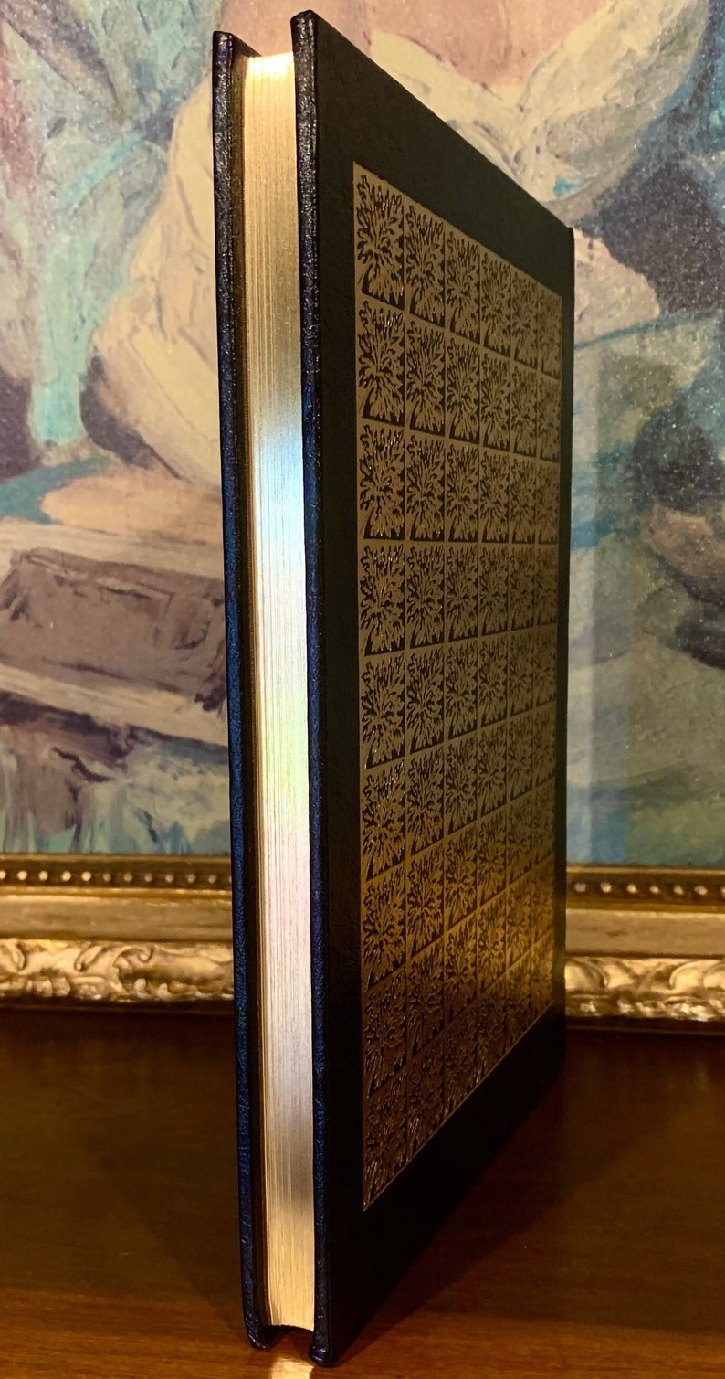 Close-up of the gilded page edges of Heart of Darkness by Joseph Conrad – 1980 Easton Press edition. Features raised bands and gold embossed title on premium black leather. Ideal for collectors of Easton Press and heirloom-quality literature.