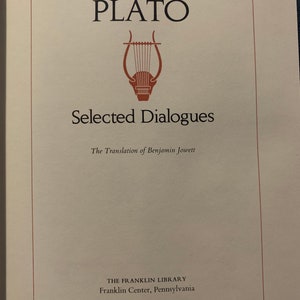 May include: A book cover with the title "PLATO Selected Dialogues" and the text "The Translation of Benjamin Jowett" below. The cover features a red lyre and the text "THE FRANKLIN LIBRARY Franklin Center, Pennsylvania".