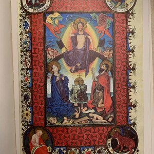 A medieval manuscript page with a red and gold border. In the center, a man with a halo sits on a throne with his arms outstretched. Four smaller images are in the corners, each with a different animal and the words 'St. Johannes', 'St. Markus', 'St. Matthaeus', and 'St. Lucas'.
