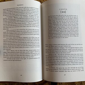 May include: An open book with a brown leather cover. The pages are open to Canto 10 of Inferno by Dante Alighieri. The text is in black and white and the page numbers are 40 and 41.