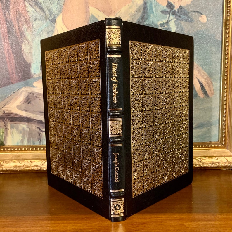 Heart of Darkness by Joseph Conrad – 1980 Easton Press leather-bound collector’s edition. Features black leather cover with gold gilt spine and raised bands. A luxurious vintage classic for fans of fine literature and collectible Easton Press books.
