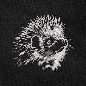 May include: A detailed, embroidered image of a hedgehog in white thread on a black background. The hedgehog is depicted in profile, with its quills, ear, and snout clearly defined. The embroidery style gives a textured, artistic look.