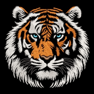 May include: Close-up of a tiger's face with orange and white fur, blue eyes, and a black nose. The tiger's face is embroidered on a black background.