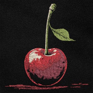 May include: Embroidered cherry on a black backdrop. The cherry is a deep red with white and pink detailing, and a green stem and leaf. The design has a textured, stitched appearance, with a shadow cast below the cherry.