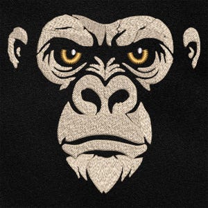 Pode incluir: Bordado de um rosto de gorila sobre um fundo preto. O rosto do gorila é detalhado com fio bege, com olhos amarelos e uma aparência texturizada. O design é centrado, mostrando as características do macaco.