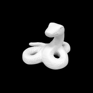 May include: White ceramic snake figurine with a coiled body and raised head. The snake has a textured surface and a simple design.