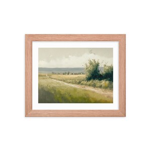 May include: A framed painting of a rural landscape with a dirt road leading to a small village in the distance. The painting features a green field, a cloudy sky, and a single tree on the right side of the road.