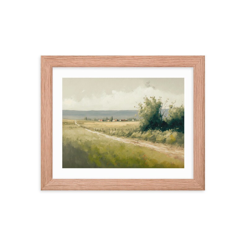 May include: A framed painting of a rural landscape with a dirt road leading to a small village in the distance. The painting features a green field, a cloudy sky, and a single tree on the right side of the road.