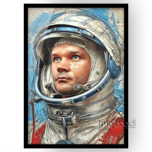May include: A framed art print featuring a portrait of an astronaut in a space helmet. The artwork has a watercolor style with blue, white, and red accents. The astronaut is looking up with a determined expression. The print is in a black frame.