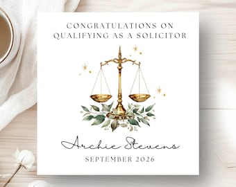 May include: A square greeting card with the text "CONGRATULATIONS ON QUALIFYING AS A SOLICITOR". It features a gold scale of justice illustration with green leaves and the name "Archie Stevens" and the date "SEPTEMBER 2026".