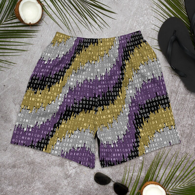 May include: Purple, gold, white, and black patterned athletic shorts with a binary code design.