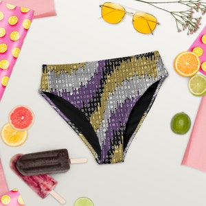 May include: Black swimsuit with a geometric pattern of purple, yellow, and white stripes and binary code. The swimsuit is on a white background with fruit and other summer-themed items.