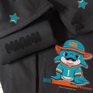 Grafik MIA Delfine Football Puff Hoodie, Miami Delphine Fußball, Delfine Fußballfan Geschenk, Delfine Spieltag Shirt, Vintage Miami, Flossen