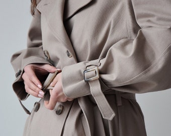 Beige trenchcoat voor dames, Beige relaxte trenchcoat met riem, Lange katoenen jas, Oversized vintage stijl trenchcoat voor herfst en lente